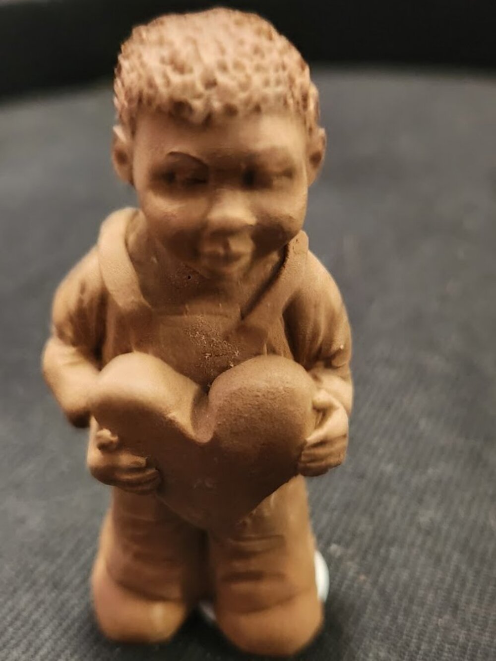 "Boy Holding a Heart" from the 1991 TnT folk art series
